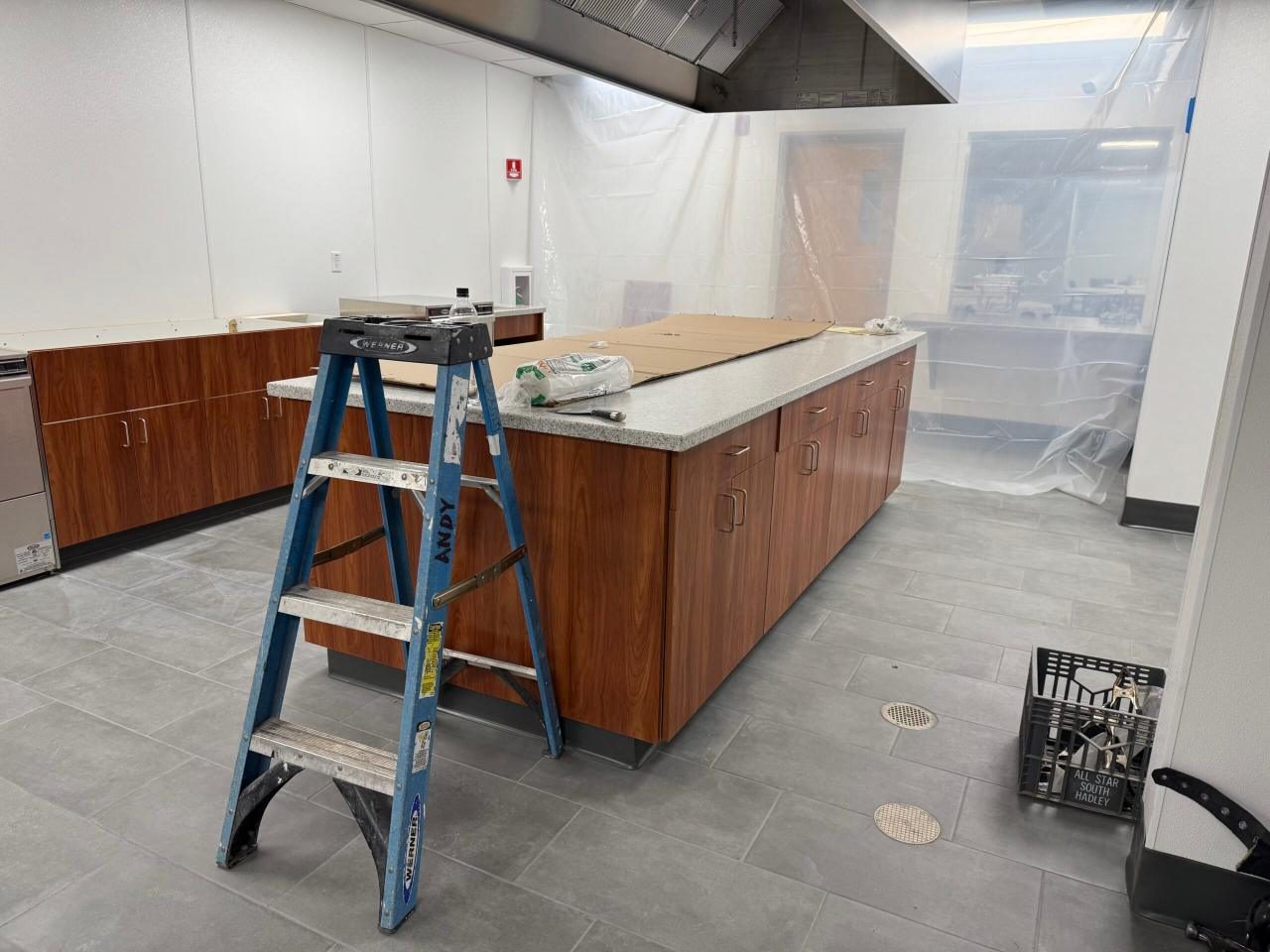 Casework with countertops being installed