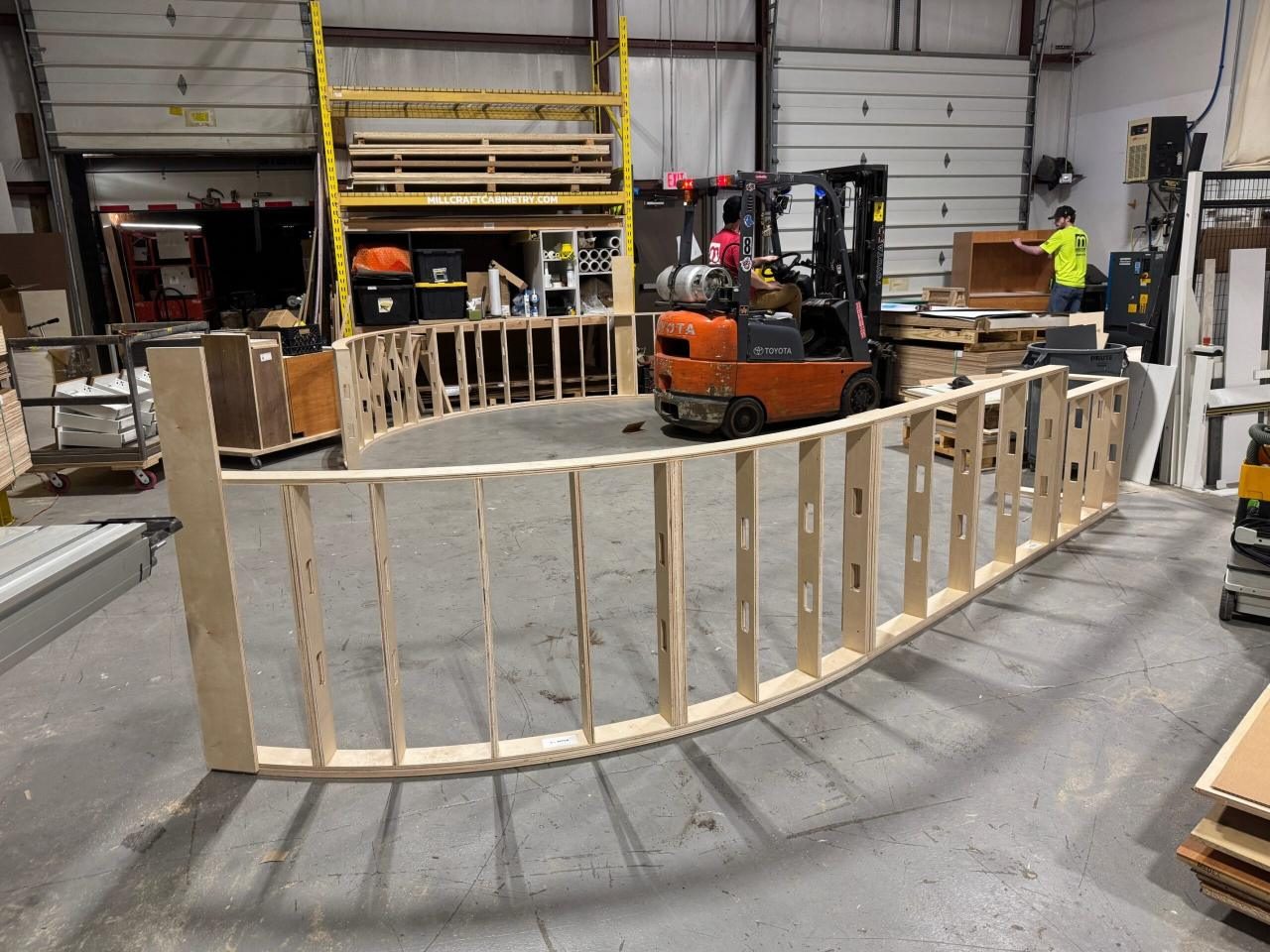 Curved reception desk being built in the Millcraft shop